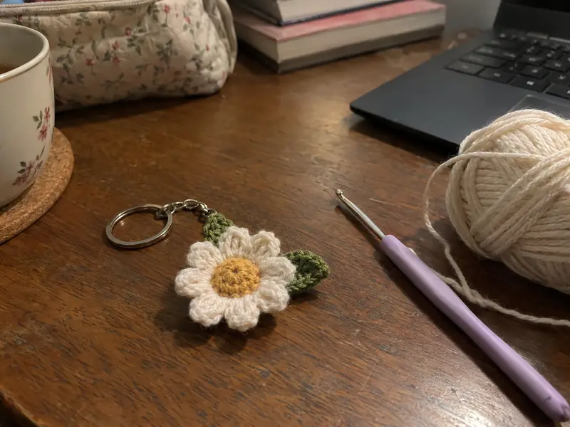 A crochet keychain in his team's colours